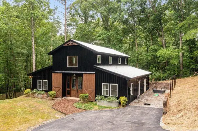 Black Barndominium in a Forest Setting