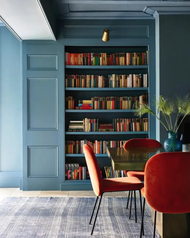 Colorful Library Featuring Blue Shelves Red Chairs