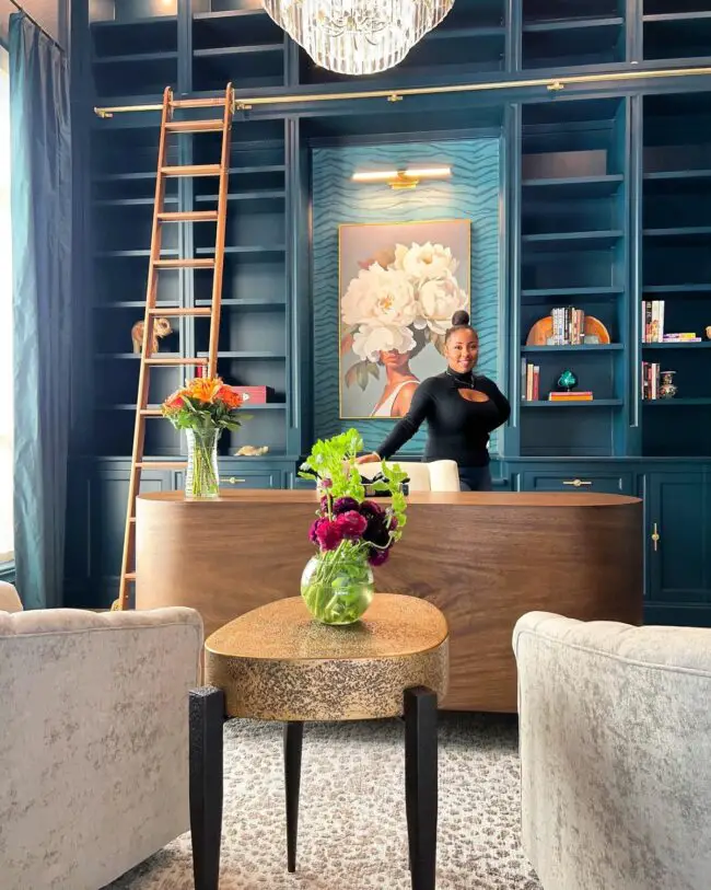 Stunning Library Featuring Ladder and Chandelier