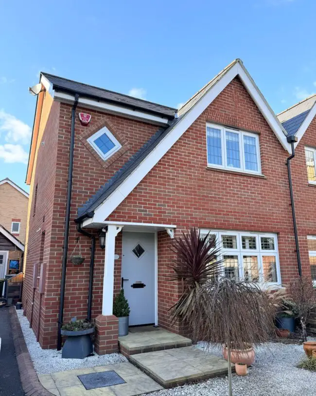 Modern Red Brick Cottage with White Details