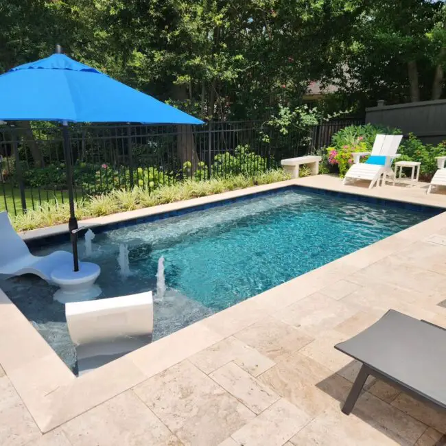 Inviting Pool Design Featuring Playful Fountains