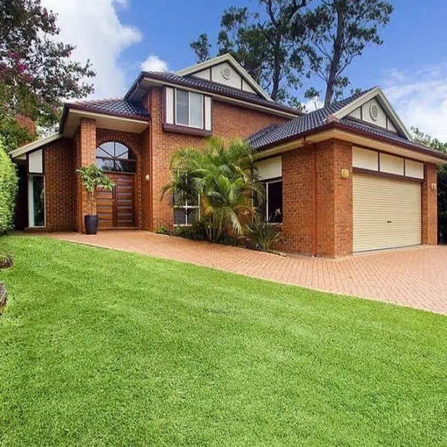 Spacious Suburban Brick Home Surrounded by Lush Landscaping